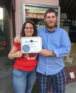 Shari Paylover and Matt Converse, Concessions Staff and Theatre Manager, show off their pleasure at receiving the Best of Columbia County Award for Best Local Movie Theatre